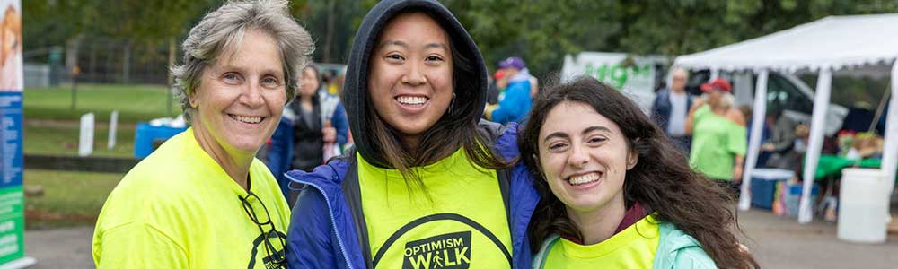 three women at an Optimism walk