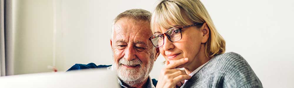 older couple looking at a laptop